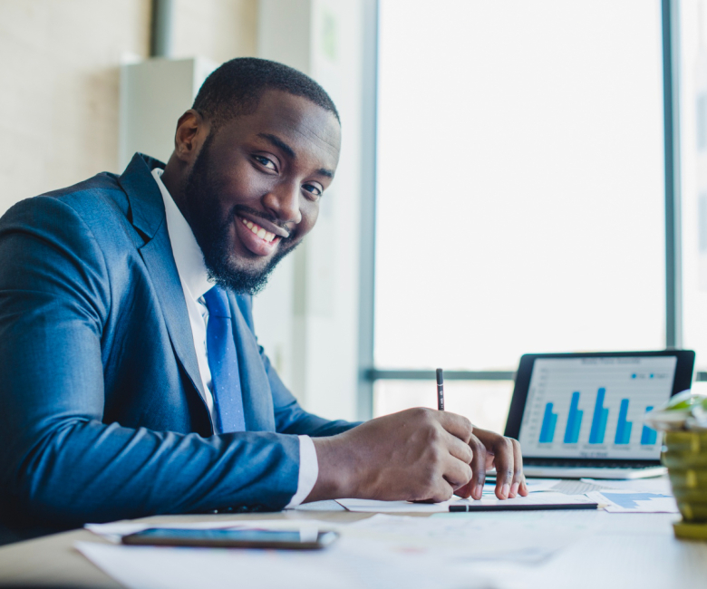 smiling-businessman-signing-contract